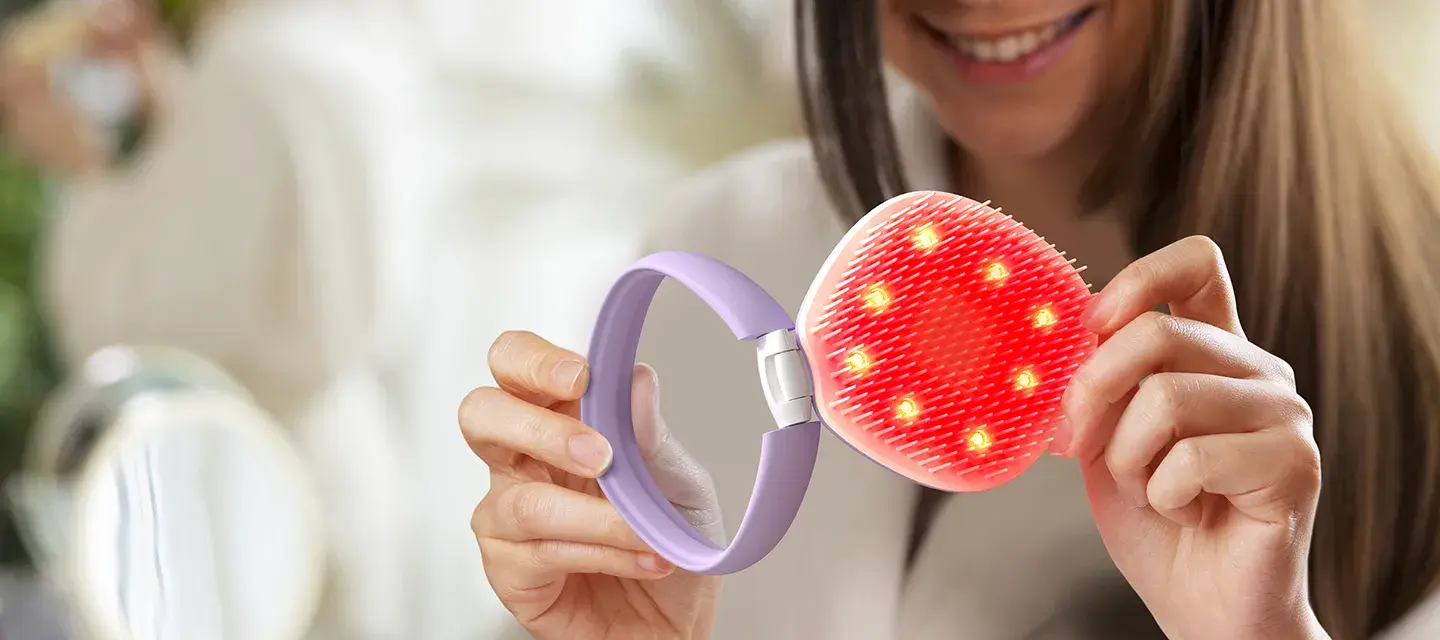 A woman opening FLIP™ play Advanced LED Light Hairbrush